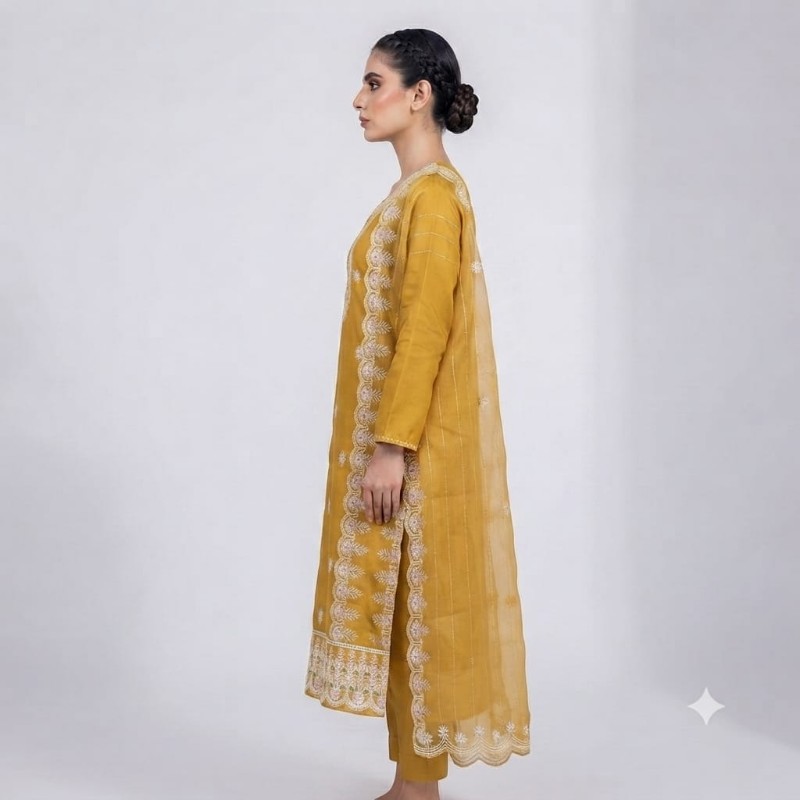 womens mustard yellow embroidered kurta, trouser, and dupatta set.